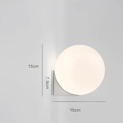 Minimalist brass and glass ball art wall lamp for bedroom