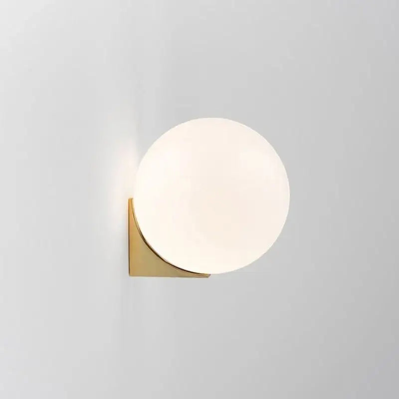 Minimalist brass and glass ball art wall lamp for bedroom