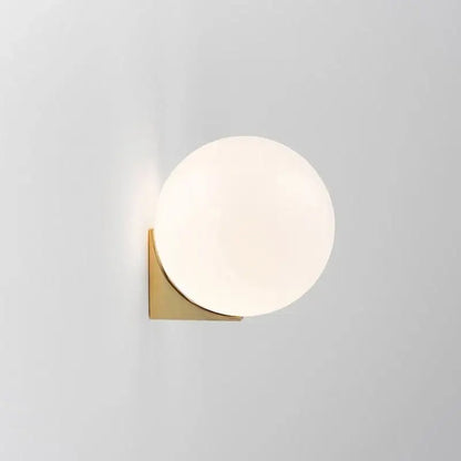 Minimalist brass and glass ball art wall lamp for bedroom