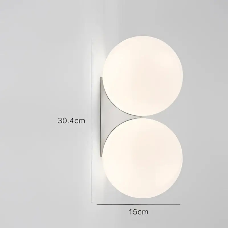 Minimalist brass and glass ball art wall lamp for bedroom