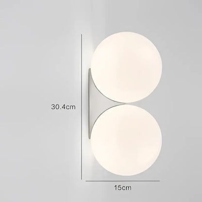 Minimalist brass and glass ball art wall lamp for bedroom