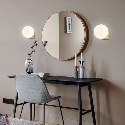 Minimalist brass and glass ball art wall lamp for bedroom