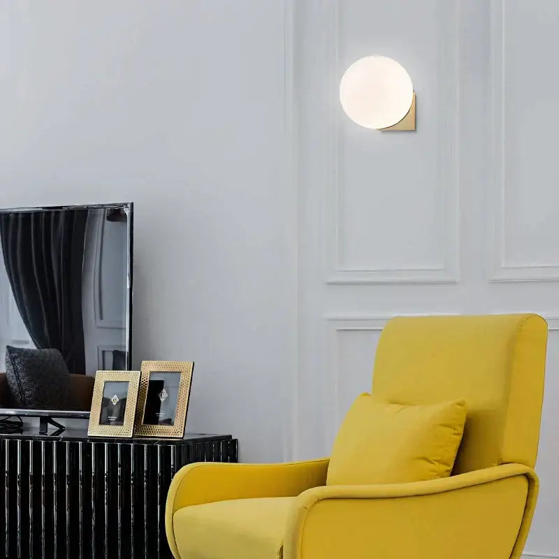 Minimalist brass and glass ball art wall lamp for bedroom