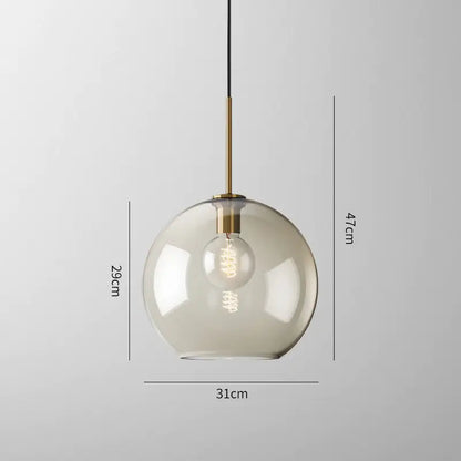 Modern smoked glass pendant lights with brass accents for kitchen island