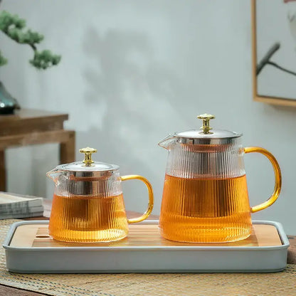 Modern glass teapot with gold knob and cups dining room tea set