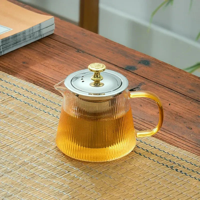 Modern glass teapot with gold knob and cups dining room tea set