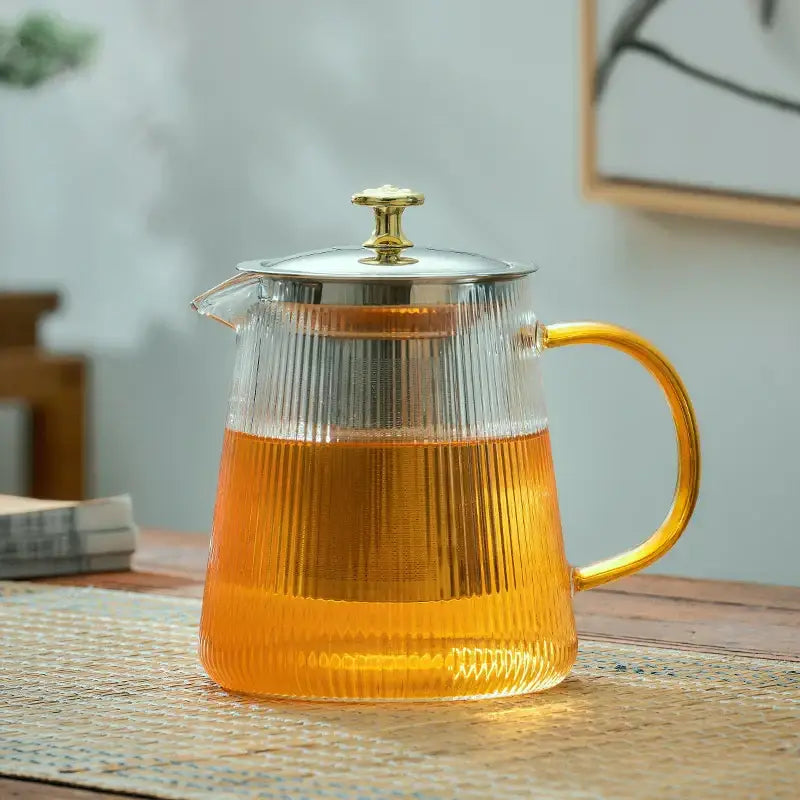 Modern glass teapot with gold knob and cups dining room tea set