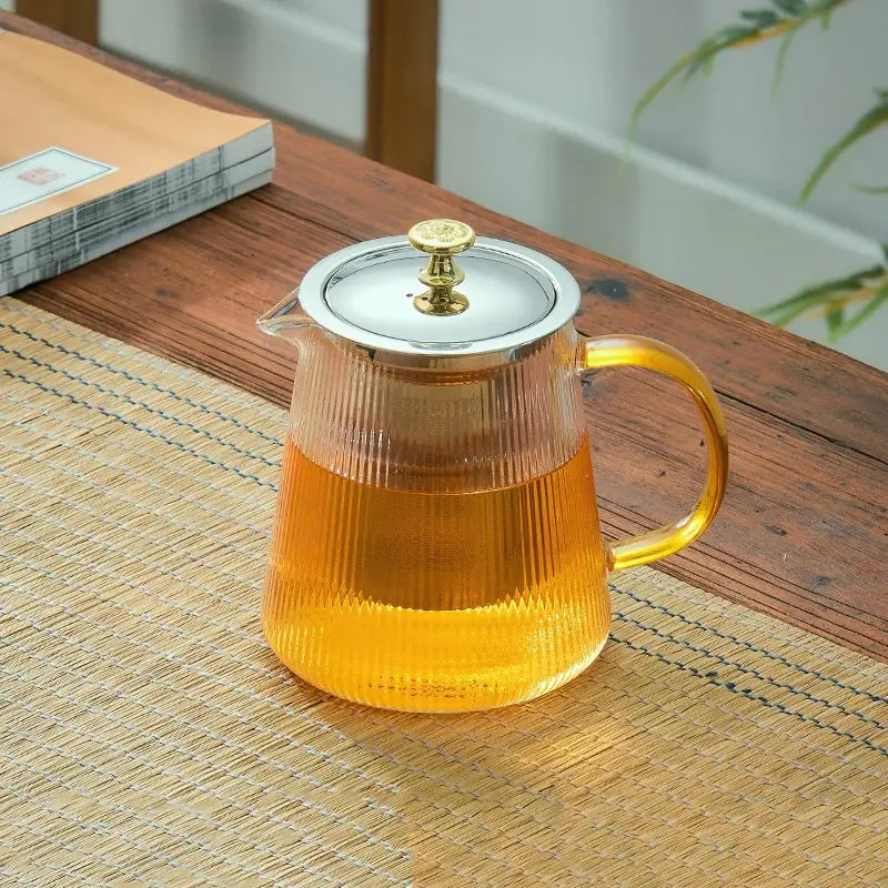 Modern glass teapot with gold knob and cups dining room tea set