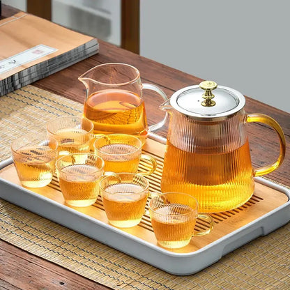 Modern glass teapot with gold knob and cups dining room tea set