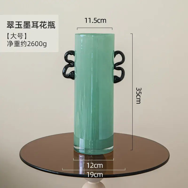 Modern mint green glass vase with black handles living room decor