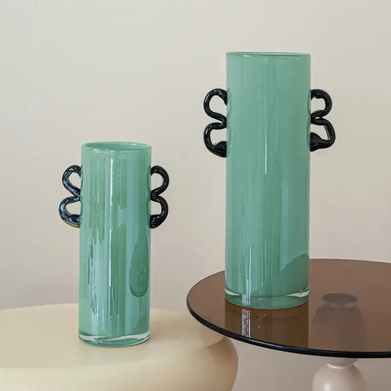 Modern mint green glass vase with black handles living room decor
