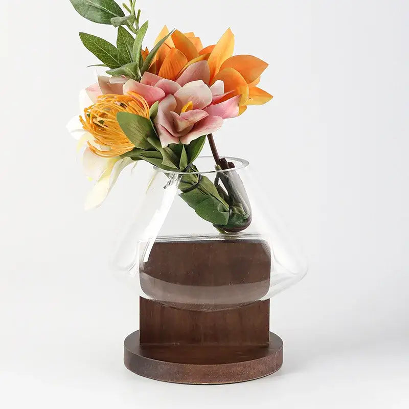 Minimalist clear glass vase with red berries and wood base living room