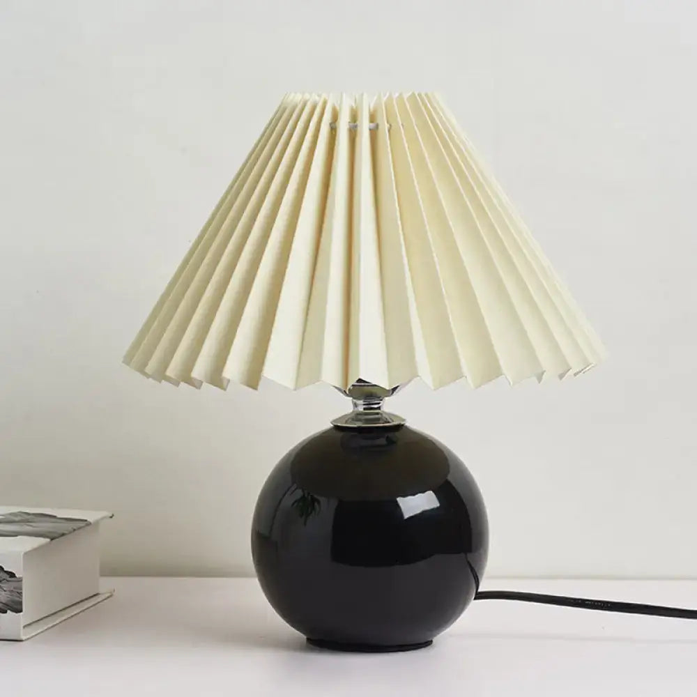 Modern black glossy ceramic bedside table lamp with pleated shade bedroom