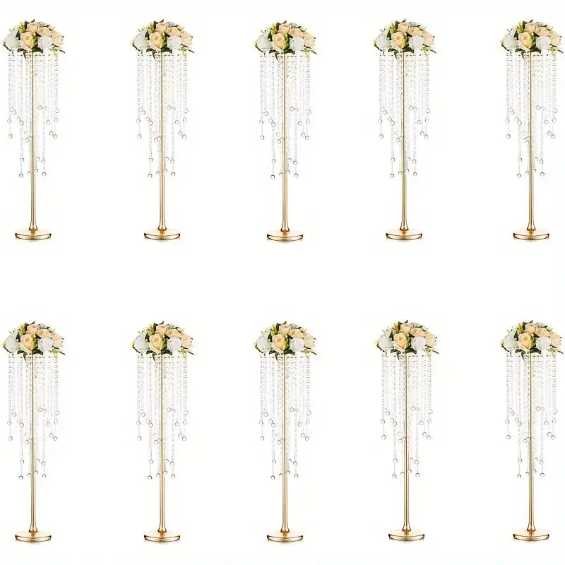 Elegant gold metal vases with crystals and roses for dining room