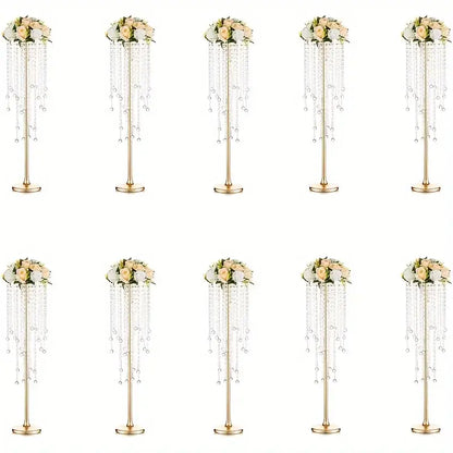 Elegant gold metal vases with crystals and roses for dining room