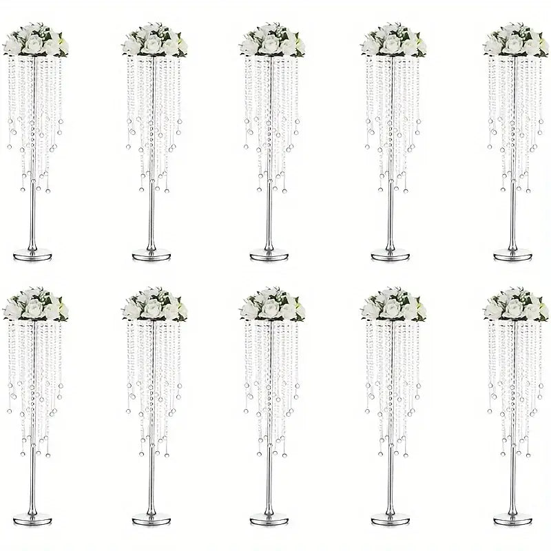 Elegant gold metal vases with crystals and roses for dining room