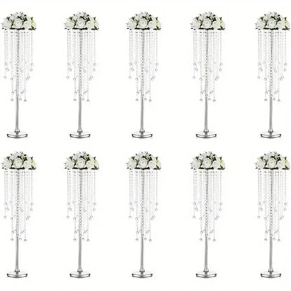 Elegant gold metal vases with crystals and roses for dining room