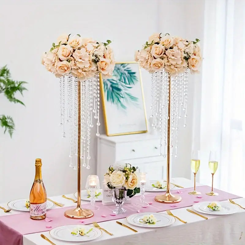Elegant gold metal vases with crystals and roses for dining room