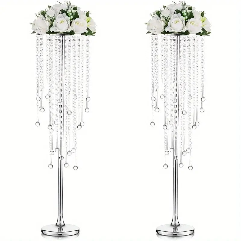 Elegant gold metal vases with crystals and roses for dining room