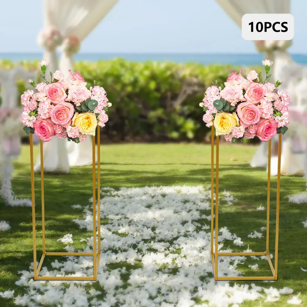 Gold metal wedding flower stand set with pink roses for dining room