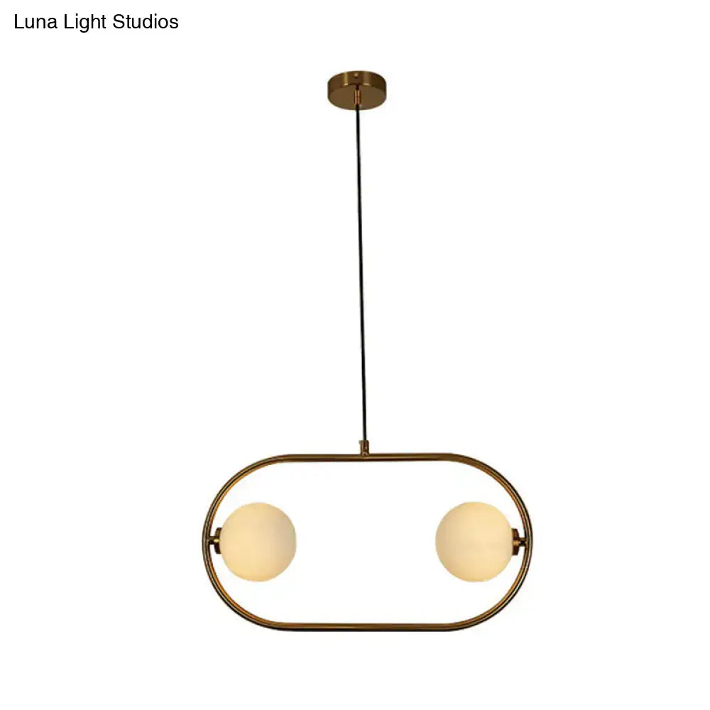 Modern gold globe hanging chandelier with frosted glass – bedroom