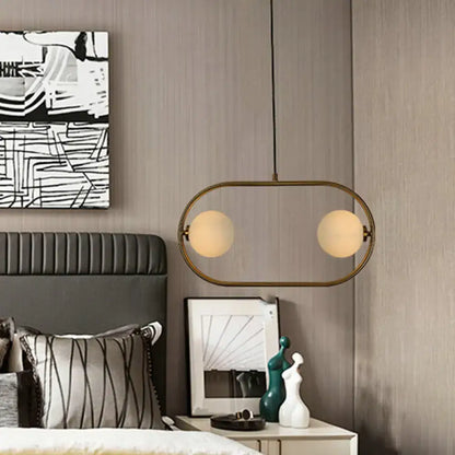 Modern gold globe hanging chandelier with frosted glass – bedroom