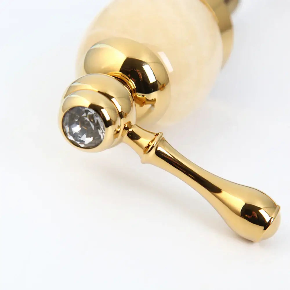 golden plated waterfall bathtub faucet with marble handles