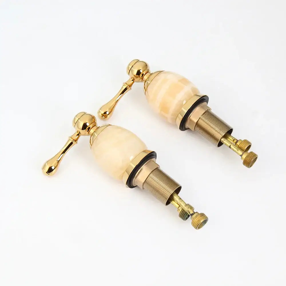 golden plated waterfall bathtub faucet with marble handles