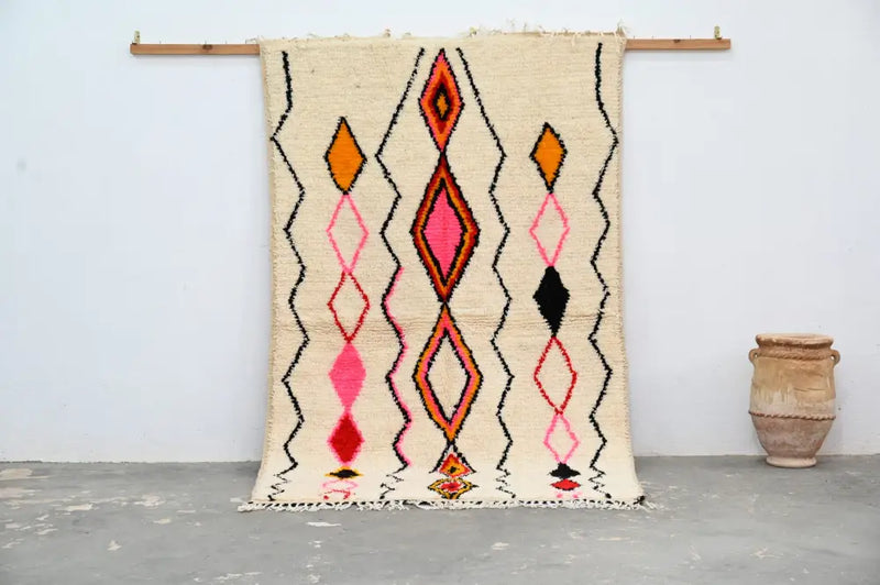 Handmade beige azilal rug with geometric patterns bedroom decor