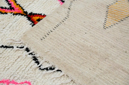 Handmade beige azilal rug with geometric patterns bedroom decor
