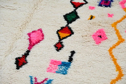 Handmade beige moroccan azilal rug with colorful patterns living room