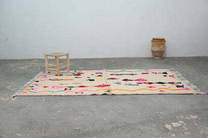 Handmade beige moroccan azilal rug with colorful patterns living room