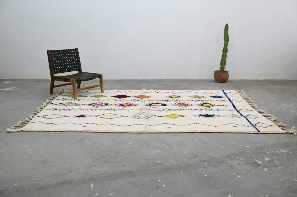 Handmade beige moroccan azilal rug with colorful diamonds living room