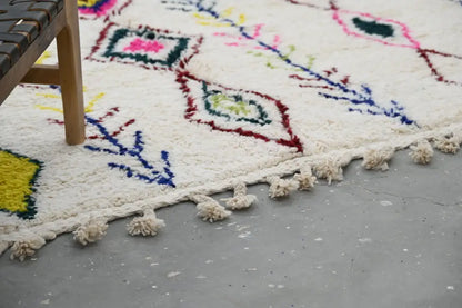 Handmade beige moroccan azilal rug with colorful diamonds living room