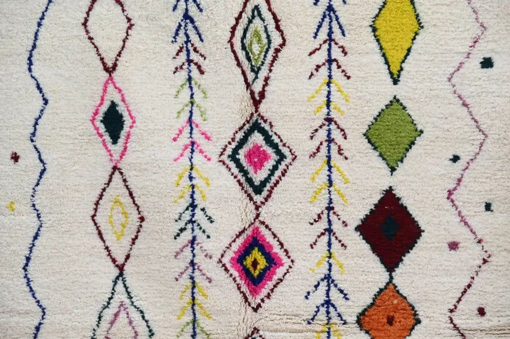 Handmade beige moroccan azilal rug with colorful diamonds living room