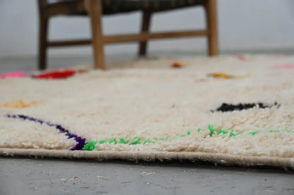 Handmade moroccan azilal rug with vibrant colors for living room