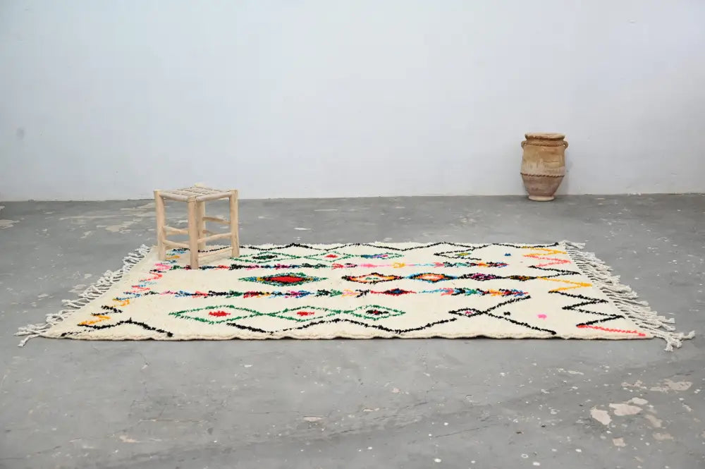 Traditional beige azilal rug with colorful patterns for living room