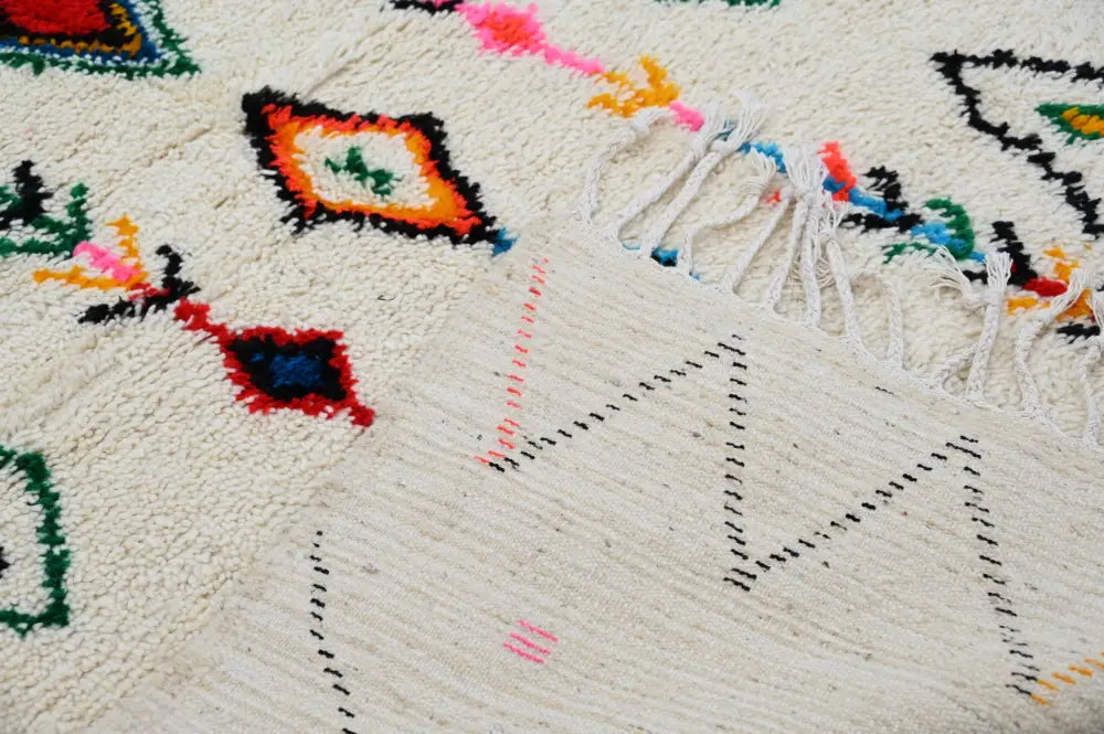 Traditional beige azilal rug with colorful patterns for living room