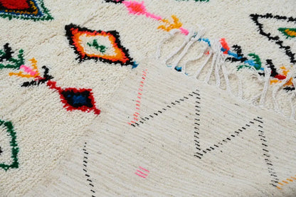 Traditional beige azilal rug with colorful patterns for living room