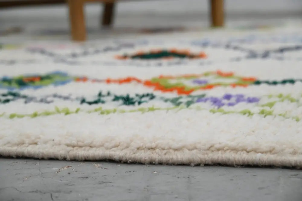 Traditional beige azilal rug with geometric patterns for living room