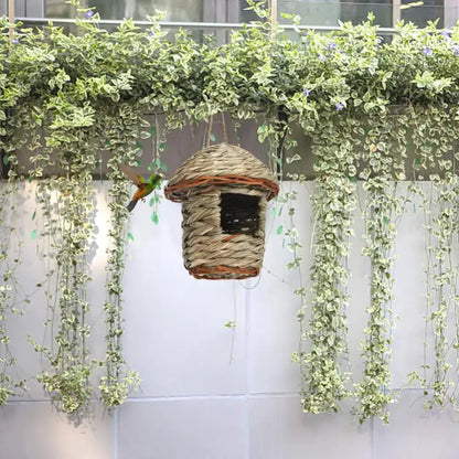 Handwoven straw bird nest with hanging rope for garden decor