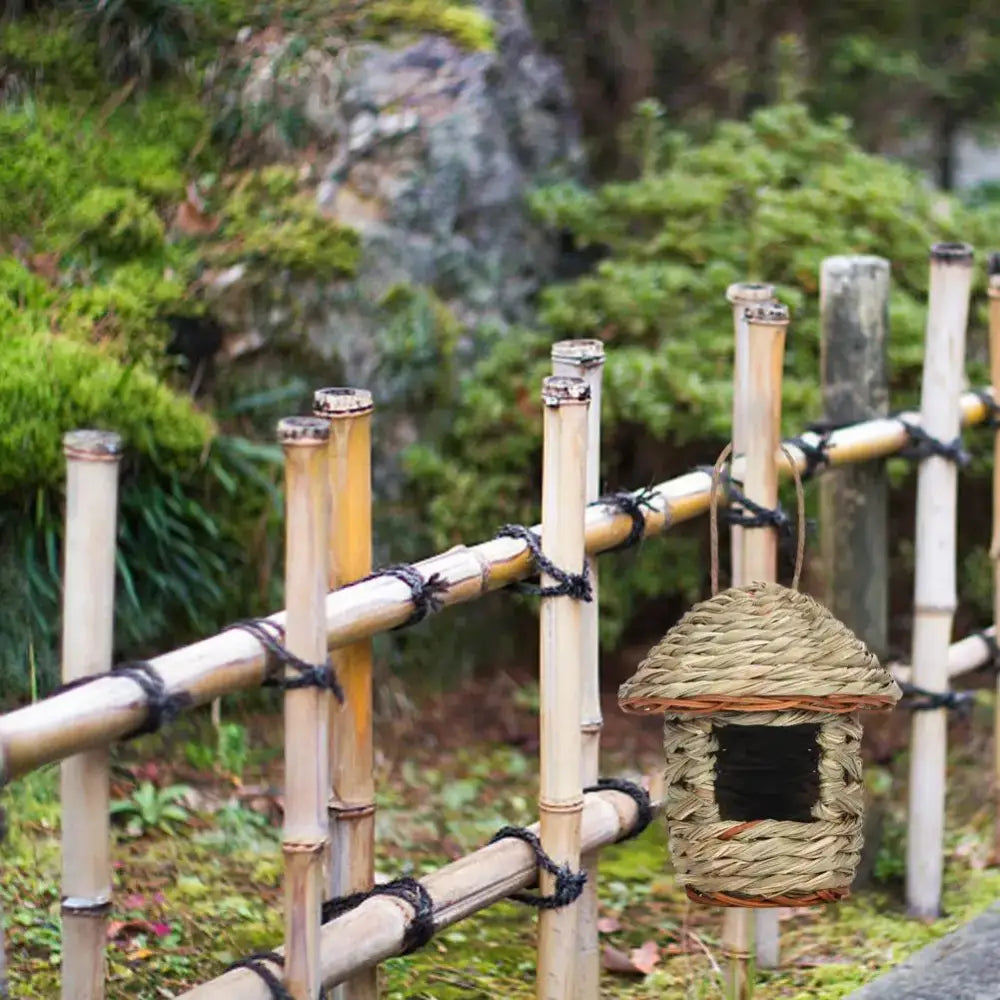 Handwoven straw bird nest with hanging rope for garden decor