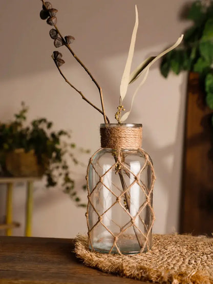 Rustic hanging glass vase with hemp rope twine netting – living room