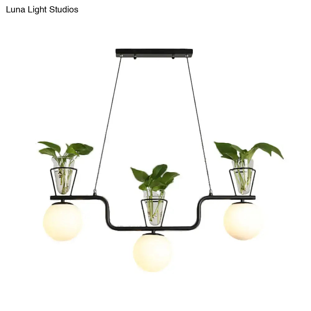 Industrial black kitchen island light with opal glass and clear glass pot