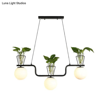 Industrial black kitchen island light with opal glass and clear glass pot