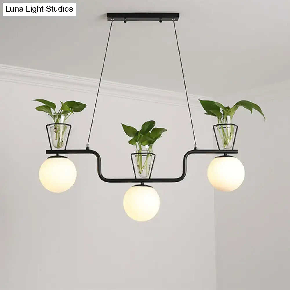 Industrial black kitchen island light with opal glass and clear glass pot