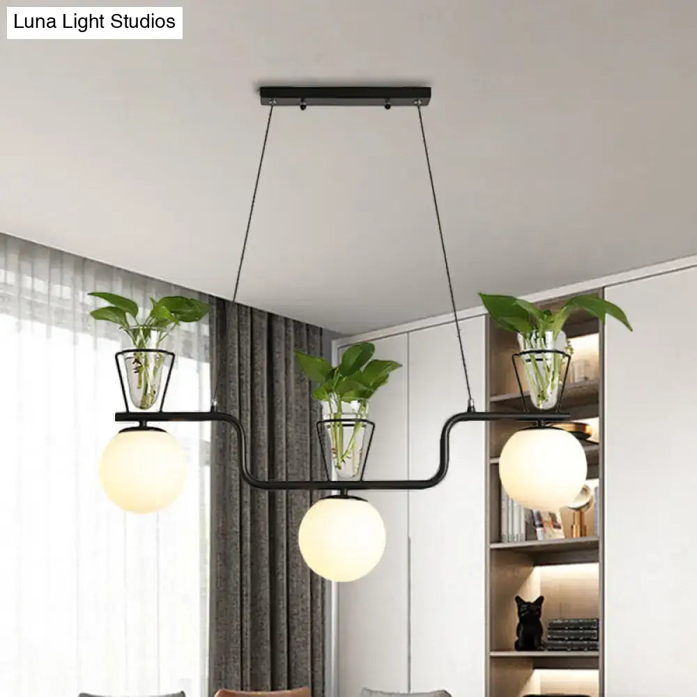 Industrial black kitchen island light with opal glass and clear glass pot
