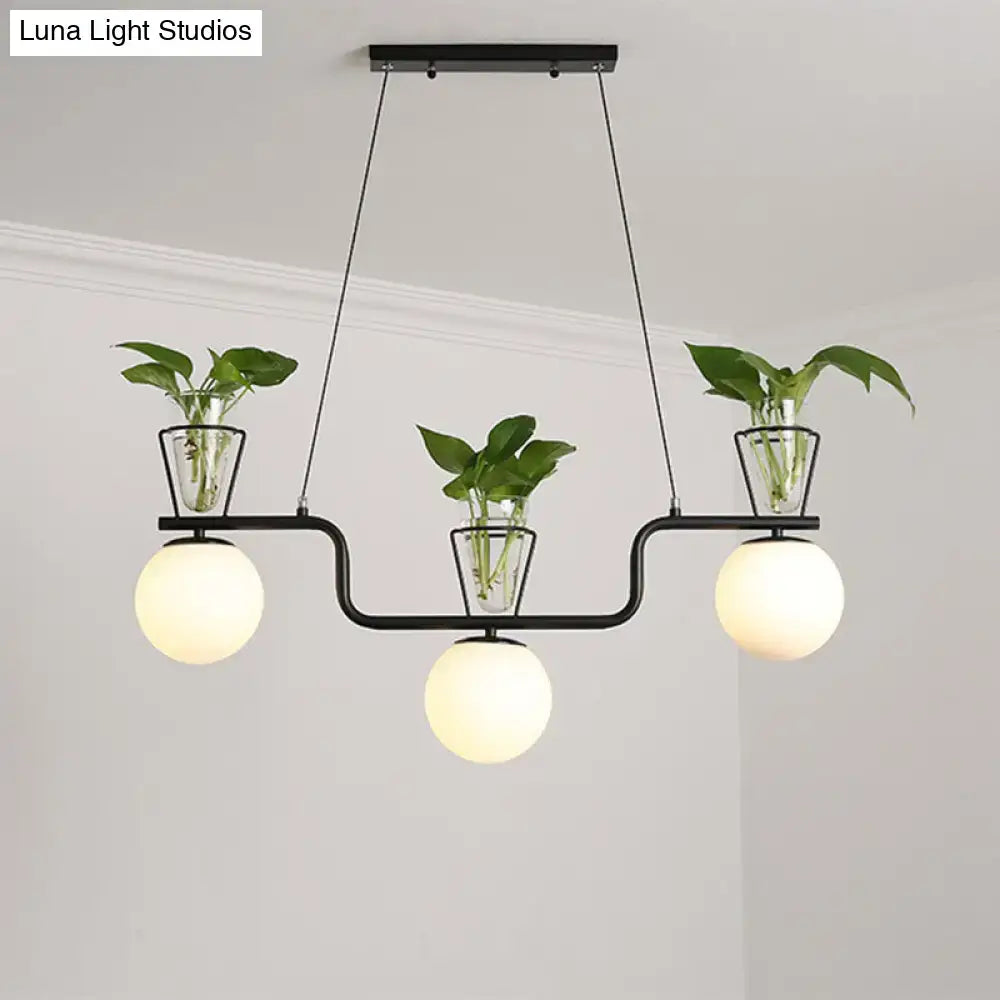 Industrial black kitchen island light with opal glass and clear glass pot