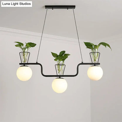 Industrial black kitchen island light with opal glass and clear glass pot