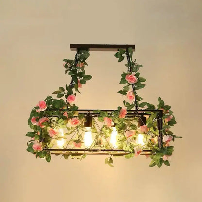 Rustic industrial cage island light with pink flowers dining room
